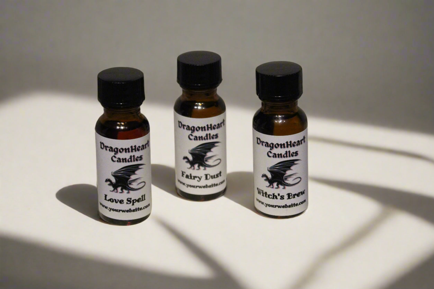 Small fragrance oil bottles with a DragonHeart label wrapped around