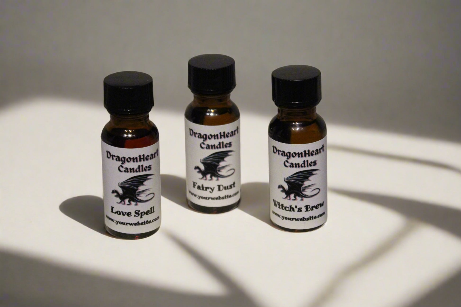 Small fragrance oil bottles with a DragonHeart label wrapped around
